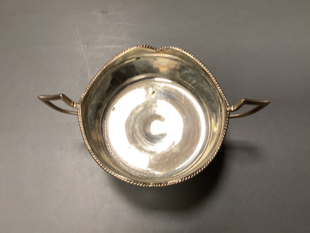 A Persian white metal sugar bowl and cover and five matching tea glass holders